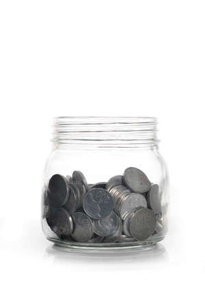 Tin Coins on the glass canの写真素材