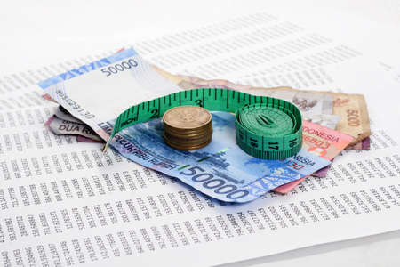 rupiah, worksheet and measure tape