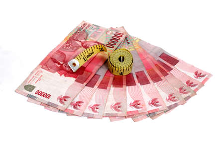  Rupiah  Indonesian Money  and measure tape on whiteの写真素材