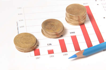 business chart, coins, blue pencilの写真素材