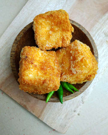 flat lays or top view, tahu sumedang (Fried Tofu) from west java,  indonesia with green hot chili at...