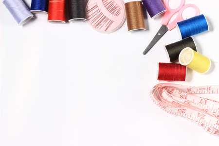 Flat lay or top view, Needle, Scissor, Thread, Tailor Meter, Scissor at White Backgroundの写真素材