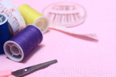 Flat lay or top view, Needle Scissor, Thread, Tailor Meter, Scissor at Pink Backgroundの写真素材