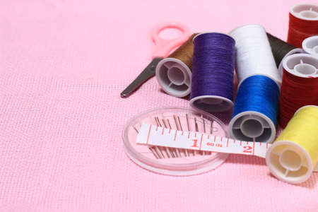 Flat lay or top view, Needle Scissor, Thread, Tailor Meter, Scissor at Pink Backgroundの写真素材
