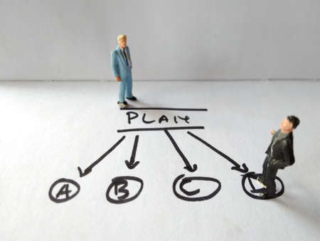 two businessmen discussing, choose the alternative plan