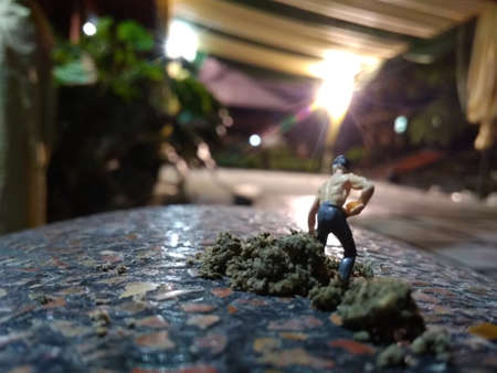 mini figure worker cement mixing manuallyの写真素材