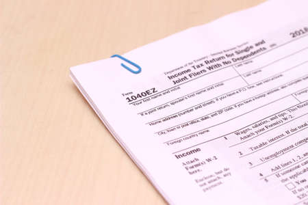 Photo close up of usa tax form type 1040ez, income tax return for single and joint filers with no...
