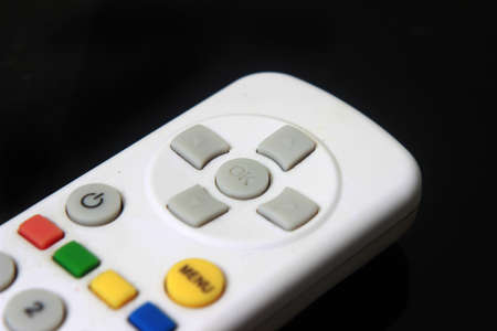 Illustration for Controlling Something, Close Up Remote Control at Black Background
の写真素材