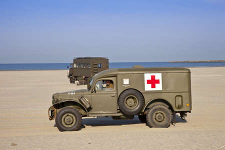 IJMUIDEN, THE NETHERLANDS-MAY 5: Kelly's Heroes medical army vehicle riding on beach on May 5,2011 in IJmuiden, The Netherlands. Kelly's Heroes celebrates the liberation of The Netherlands in 1945のeditorial素材
