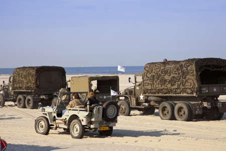 IJMUIDEN, THE NETHERLANDS-MAY 5:Kelly's Heroes Army jeeps and trucks on beach on May 5,2011 in IJmuiden, The Netherlands. Organization Kelly's Heroes celebrates liberation of The Netherlands in 1945のeditorial素材