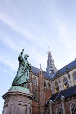 Cathedral St. Bavo with statue of printing inventor Laurens Janszoon Coster at big square Haarlem, The Netherlandsのeditorial素材