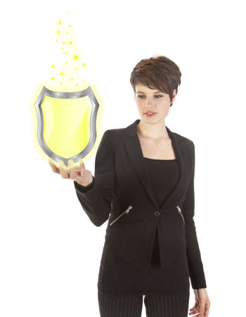 young woman holding shiny yellow shield isolated on white backgroundの写真素材