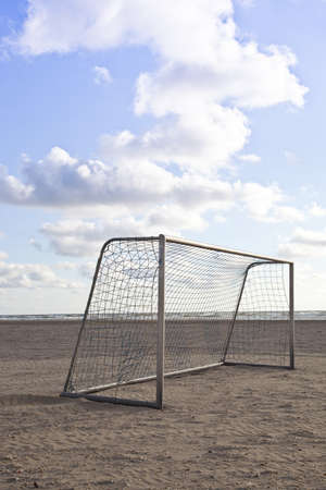 Soccer goal on beach with blue skyの写真素材