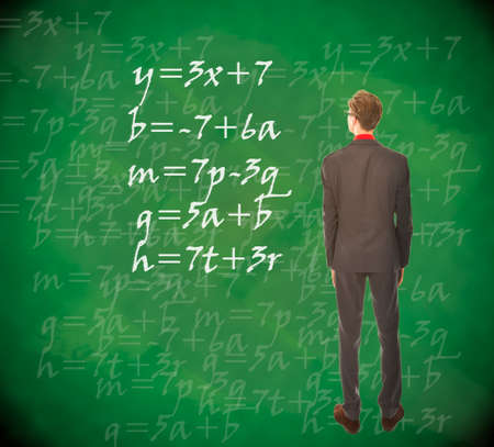 Young student looking at chalkboard with mathematics