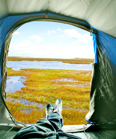 Inside of tent with view on lakeの写真素材