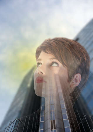 Double exposure of business woman with office buildingの写真素材