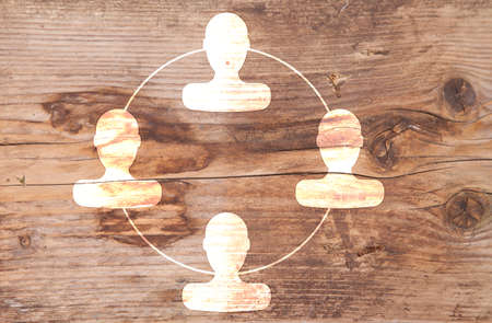 Organigram with heads on wooden backgroundの写真素材