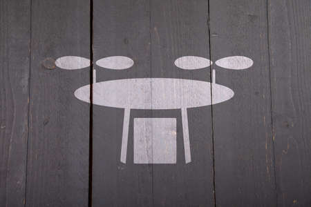 White drone on black wooden backgroundの写真素材