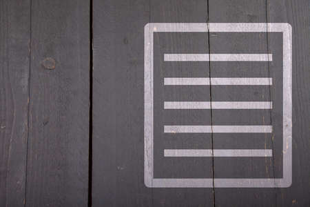 White list on black wooden backgroundの写真素材