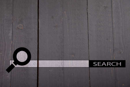 Internet search bar on black wooden backgroundの写真素材