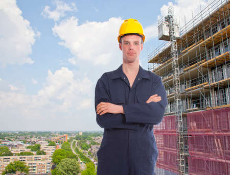 Construction worker with building and view over city