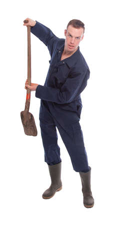 Young farmer with shovel isolated on white backgroundの写真素材