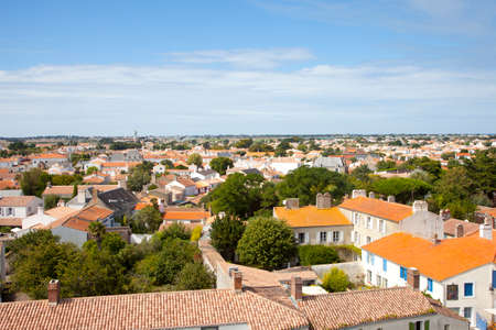 ILE DE NOIRMOUTIER, FRANCE - August 20, 2017: View at typical houses at island of Noirmoutier with red roofs and white wallsのeditorial素材