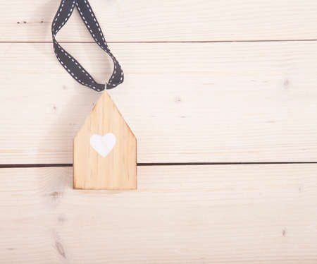 Little house on wooden backgroundの写真素材