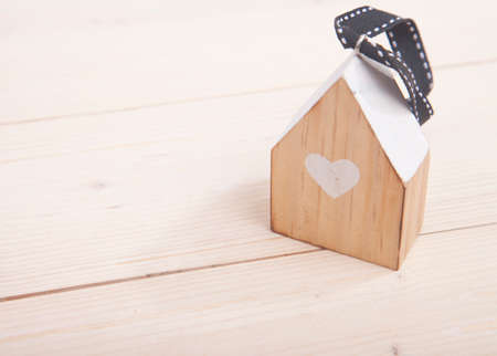 Little house on wooden backgroundの写真素材