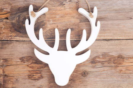 Wooden moose head on wooden backgroundの写真素材