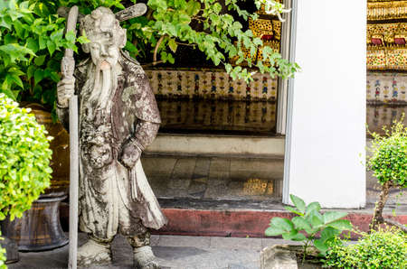 Stone guardain at Wat Suthat Thepwararam, Bangkok, Thailandの写真素材