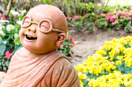 Monk statue in the gardenの写真素材