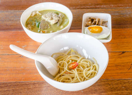 Plate with spaghetti on wooden tablの写真素材