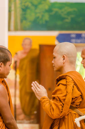 SAKONNAKHON,THAILAND December 23: Newly ordained Buddhist monk pray with priest procession. Newly ordained Buddhist monks have a ritual in the temple procession in December 23, 2012のeditorial素材