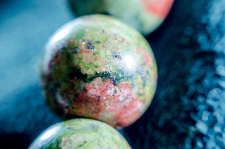Close up lucky stone gem for the gamble on backgroundの写真素材