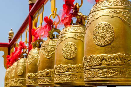 Bells in a buddhist temple of Thailandの写真素材