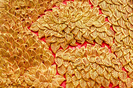 Texture of Stucco golden color tree at Wat Prathat Lampang Luang Temple Lampang Thailandの写真素材