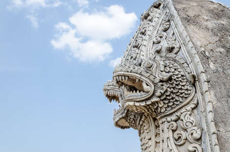 Singha and naga statue at Wat Prathat Lampang Luang Temple Lampang Thailand.の写真素材