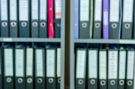 abstract blur background of row of binders in an office archiveの写真素材