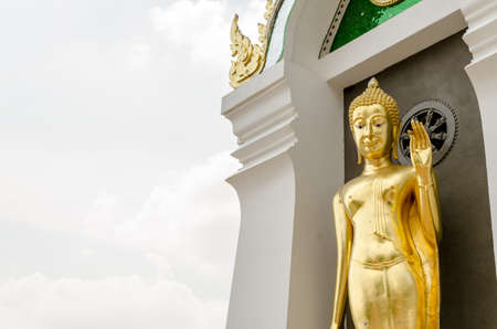 Golden buddha statue in thai templeの写真素材