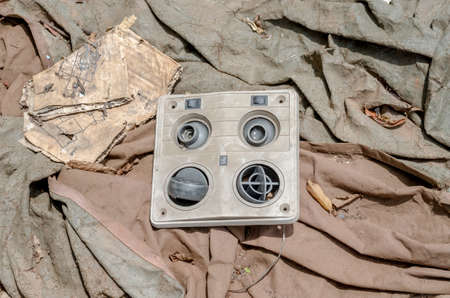 Old car aircondition register waste from car in dump site