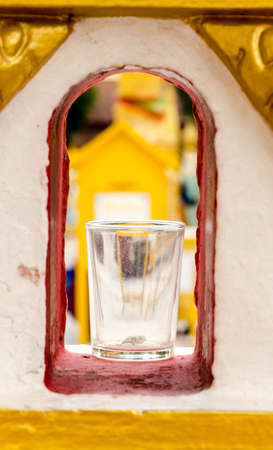 glass inside the wall at Wat Phra That Phanom, Nakhon Phanom Province, northeastern Thailand.の写真素材
