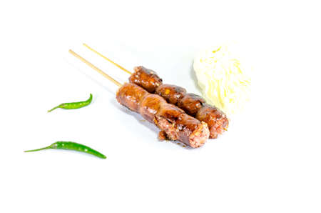 Thai Grilled Sausages on white background served with Cabbage and Chili Pepper. Thai Foodの写真素材