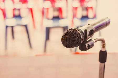 Close up of the vintage old microphone in conference roomの写真素材