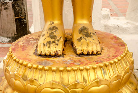 Feet of the old Buddha statue in thai temple, Thailandの写真素材