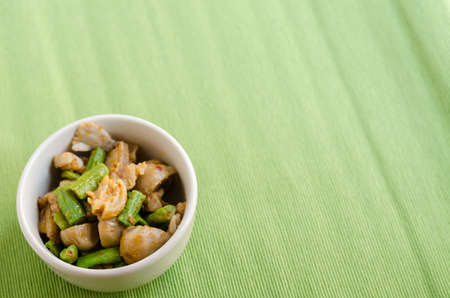 Fried spices crispy skin pork with mushroom and Yard Long bean, Thai food menuの写真素材