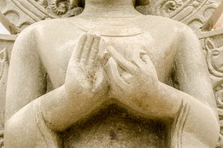 Hands of the old Buddha statue in thai temple, Thailandの写真素材