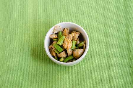 Fried spices crispy skin pork with mushroom and Yard Long bean, Thai food menuの写真素材