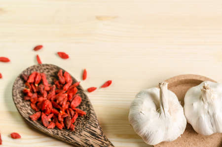 Dried goji berries on wooden tablespoonの写真素材