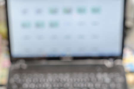 Blurred defocused motion effect on the computer notebookの写真素材